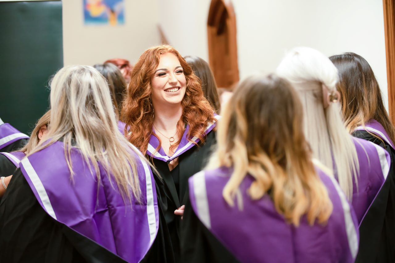 People in graduation gowns